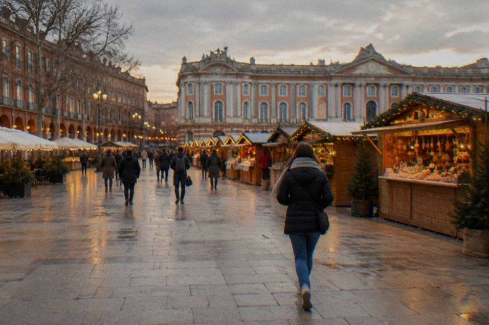 The Christmas market chalets on Place du Capitole in Toulouse at dusk