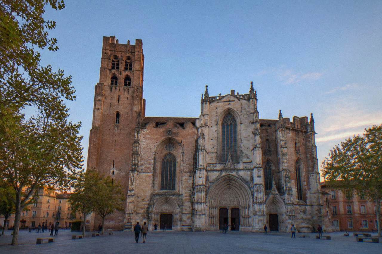 The facade of Saint-Etienne cathedral in Toulouse seen from the square in front of it