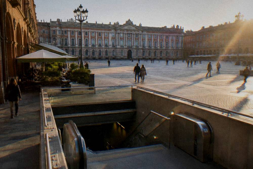 A Toulouse metro station entrance on a sunny street in the city center