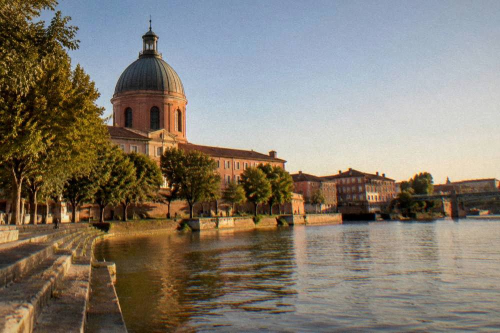 Evening light on the Garonne with the dome and hospital buildings on the far bank