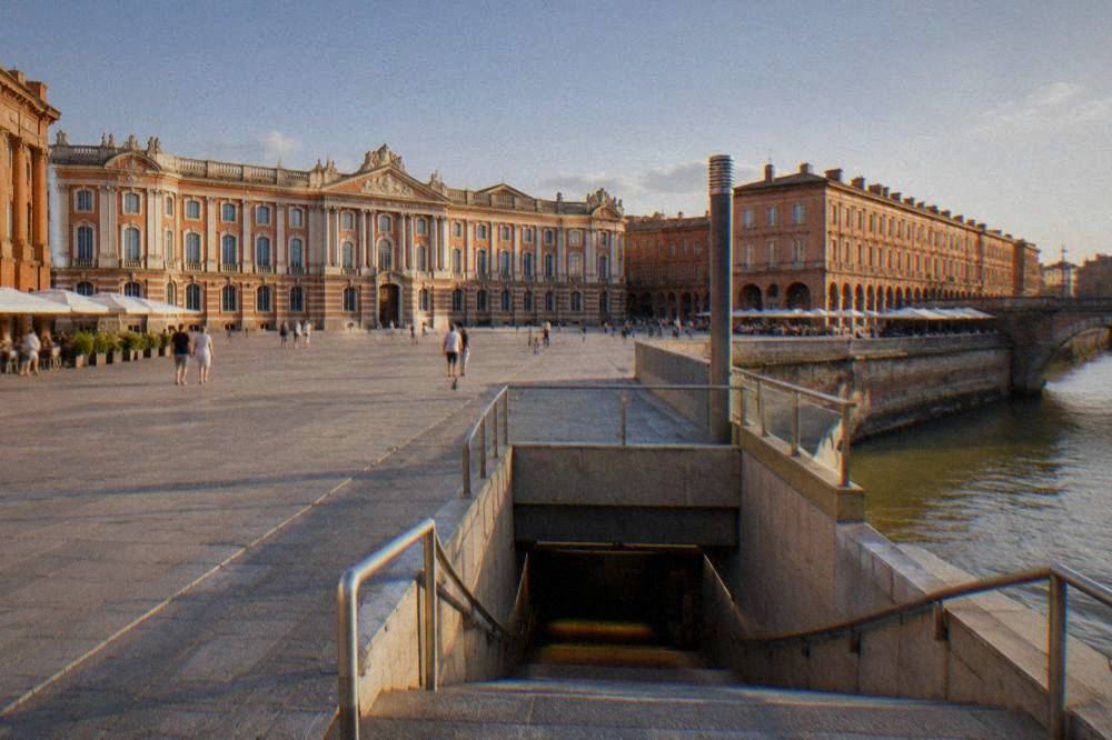 A metro station entrance near the river in central Toulouse
