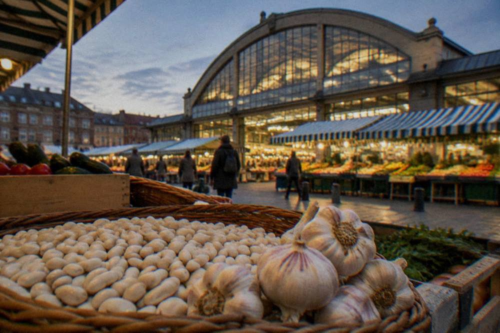 A basket of fresh white beans and garlic at a French market stall