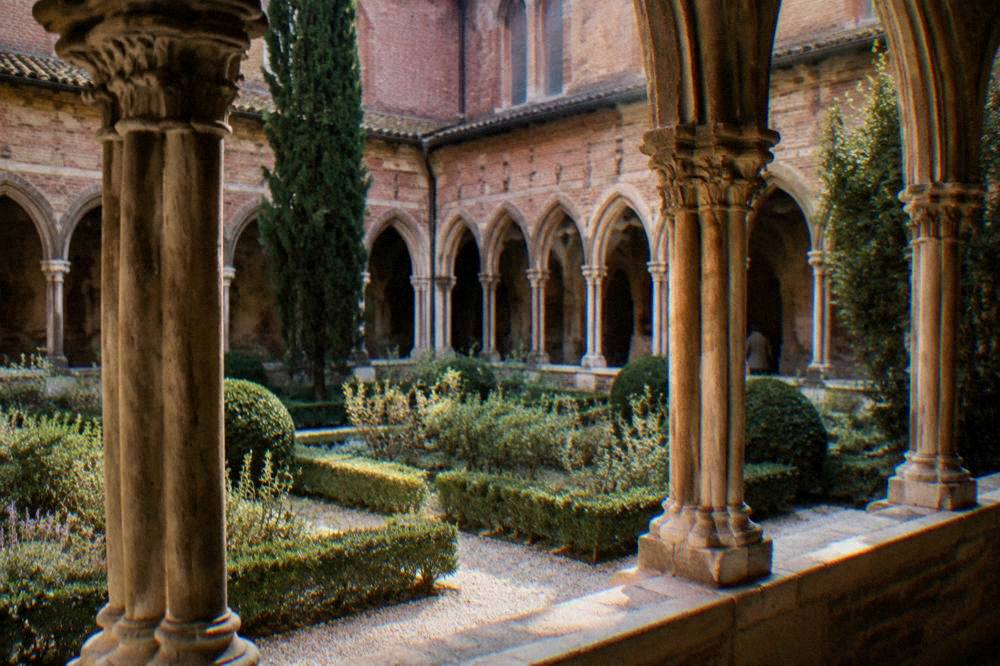 A restored convent courtyard with stone arches ready for visitors