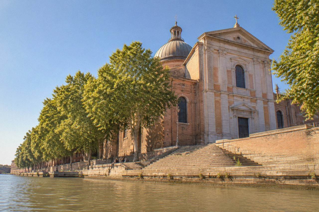 The riverside facade of Notre Dame de la Daurade church seen from the Garonne quay in Toulouse
