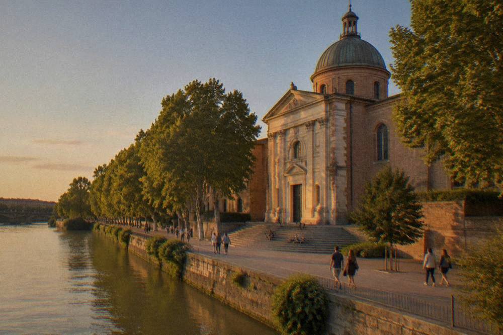 Visitors walking along the Garonne quay in front of Notre Dame de la Daurade in Toulouse