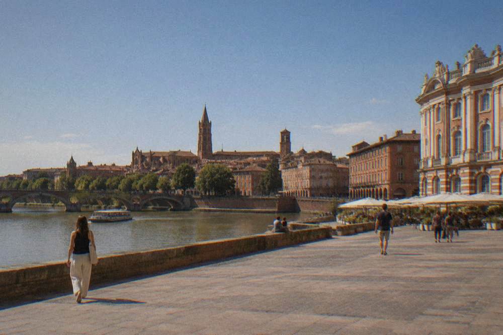 The towers and rooftops of central Toulouse seen from the quay near Notre Dame de la Daurade