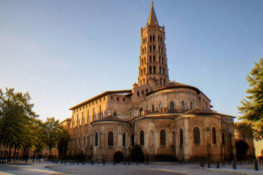 The tower of the Basilique Saint-Sernin rising at the top of Rue du Taur