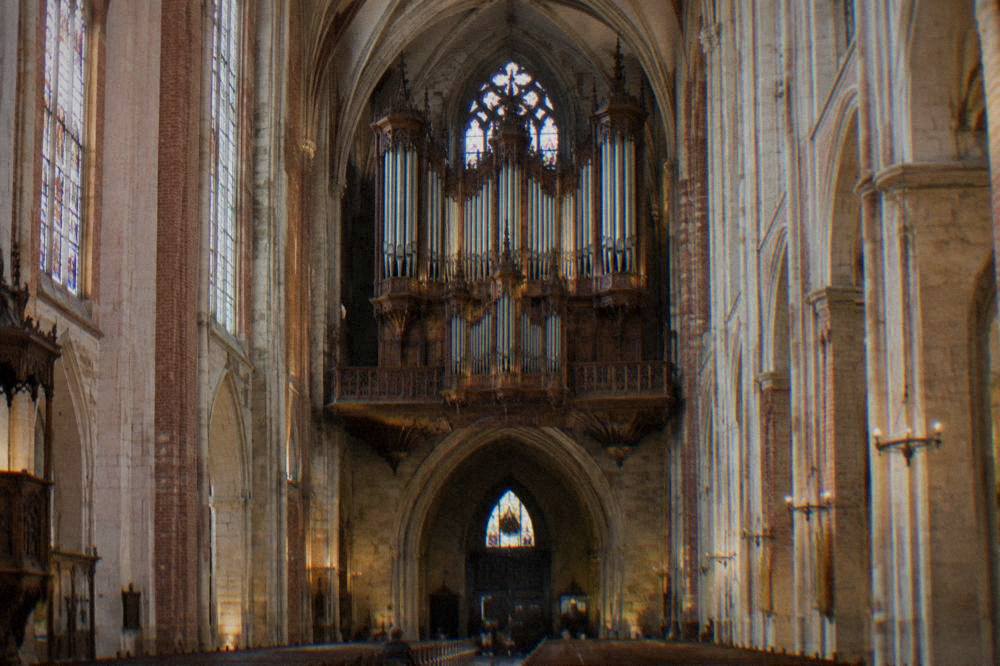 The interior of Toulouse Cathedral with an organ case above the nave