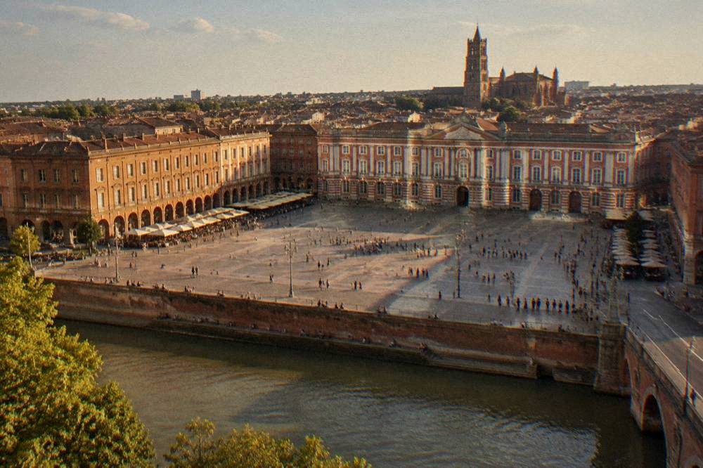 A wide view of central Toulouse with the cathedral tower rising above the rooftops