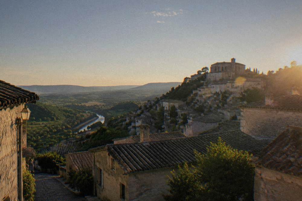 A view over rooftops and countryside from the top of a medieval hill town