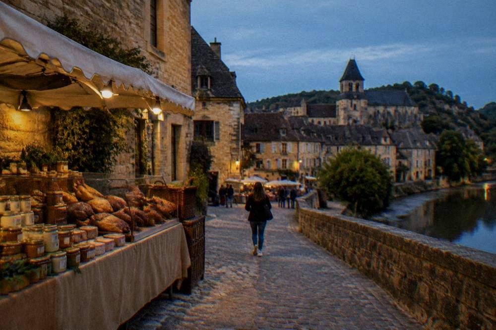 A market stall with duck confit, foie gras jars and local Perigord products
