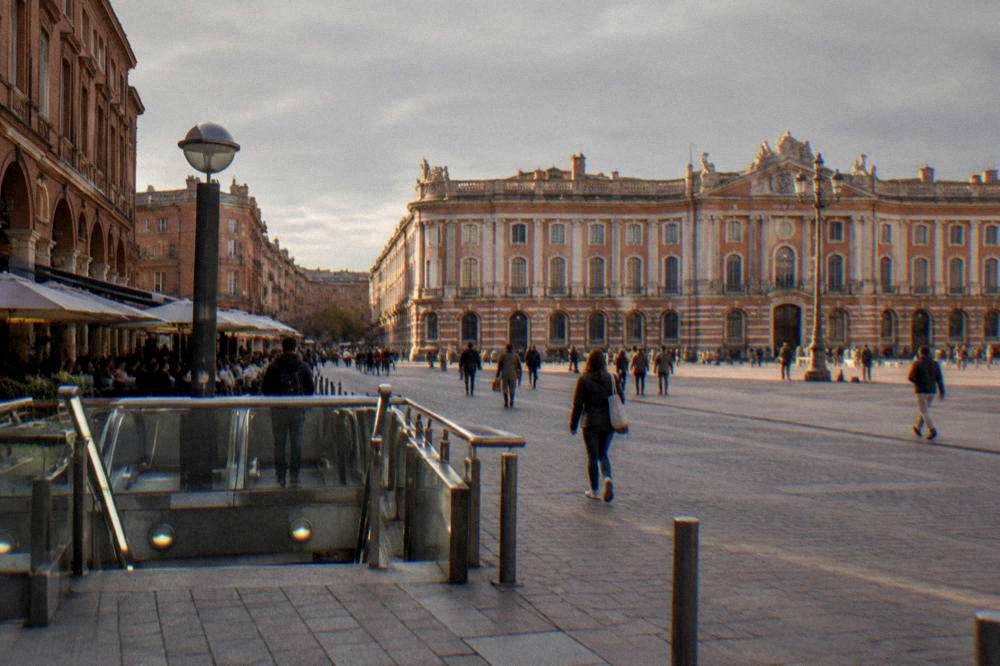 A Toulouse metro station entrance on a busy street in the city center