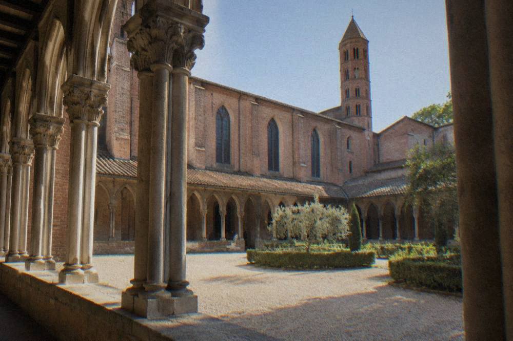The cloister columns of the Couvent des Jacobins in Toulouse lit by soft daylight