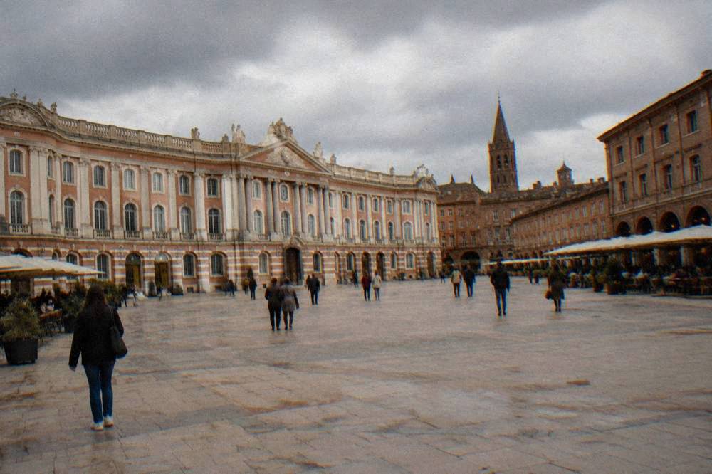 Rain clouds gathering over the rooftops and bell towers of Toulouse