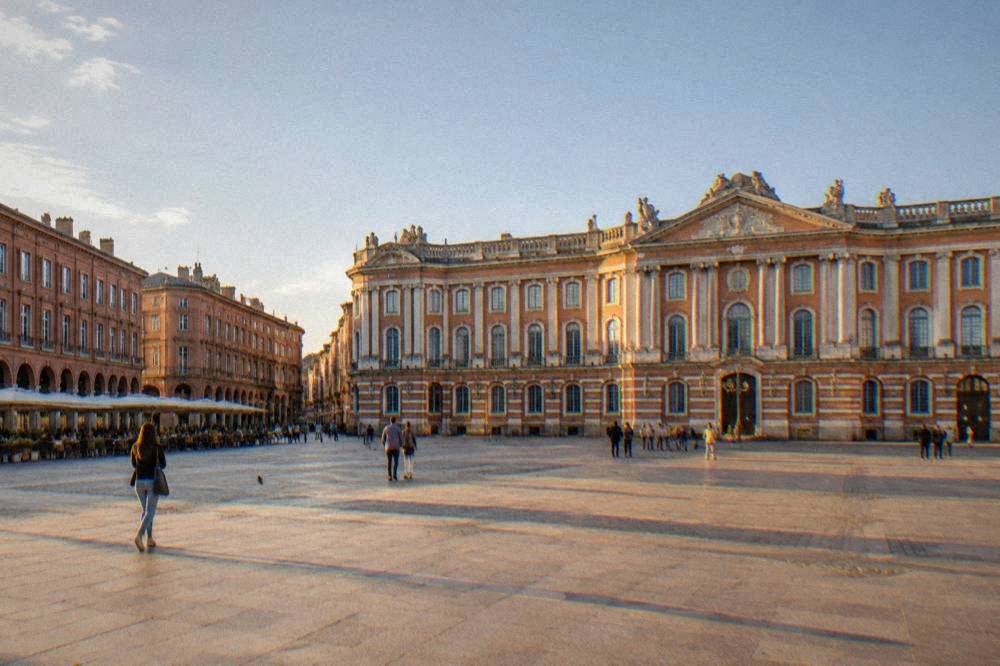 The facade of the Capitole building in Toulouse with its wide square in front
