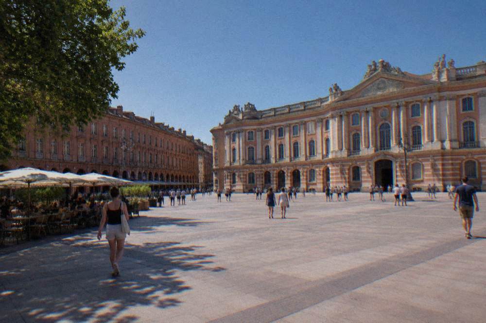 Pink Toulouse facades under a clear blue sky in early summer
