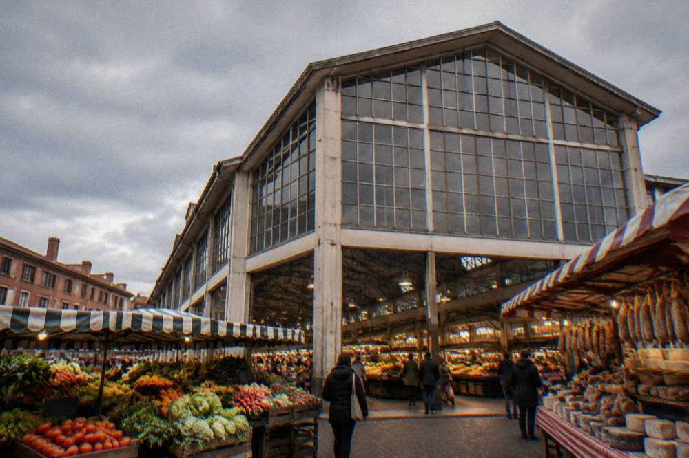 Fresh produce and regional goods on stalls at the Victor Hugo market hall