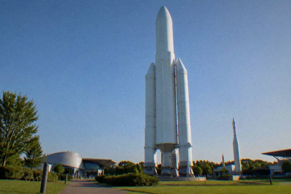 A full-scale rocket standing in the gardens of Cite de l'espace