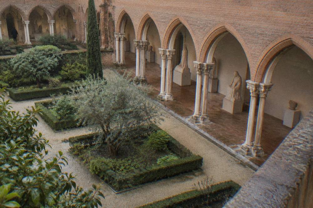 Sculptures displayed in a cloister gallery of the Musee des Augustins in Toulouse