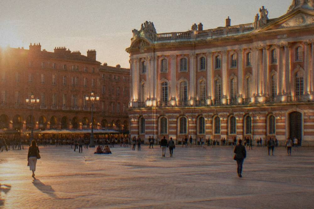 The floodlit facade of the Capitole in Toulouse seen from the square at night