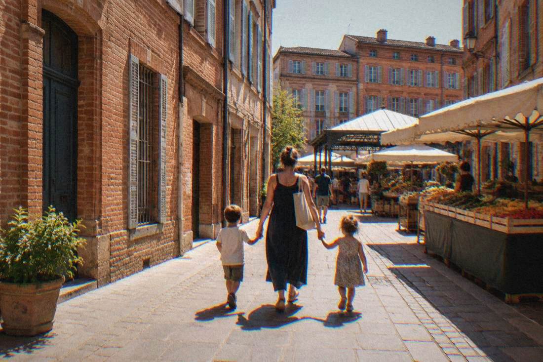 A family walking through the old town